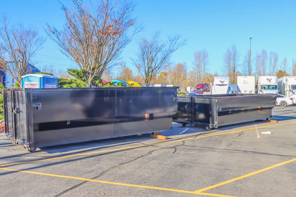 Professional dumpster rental service with roll-off container on residential driveway in Zionsville